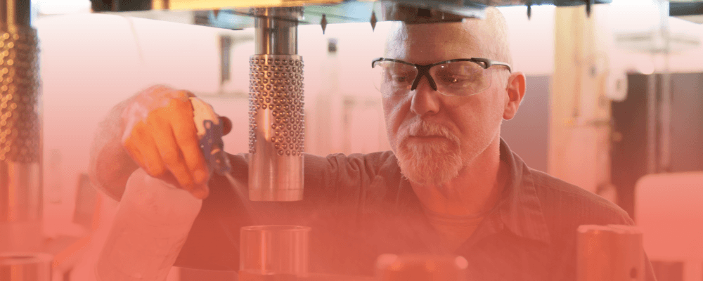 Manufacturing professional working with industrial equipment