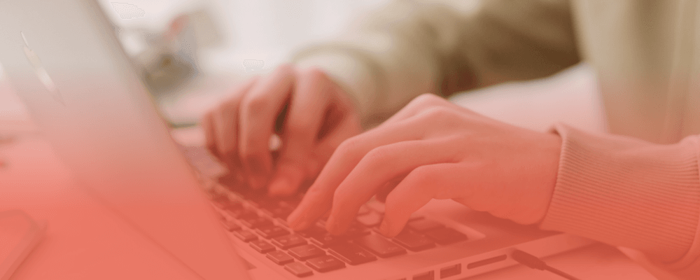 Professional using a laptop to manage product information with PIM software for manufacturers and distributors