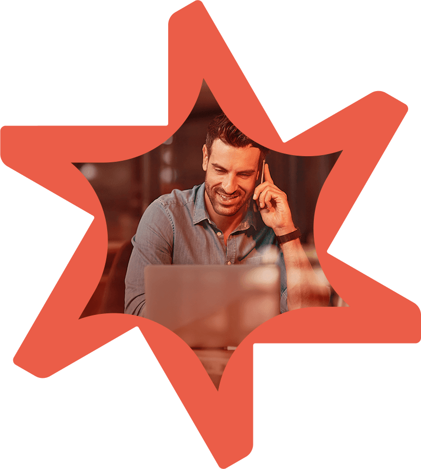 Tandemite banner: Man with a laptop talking on a phone