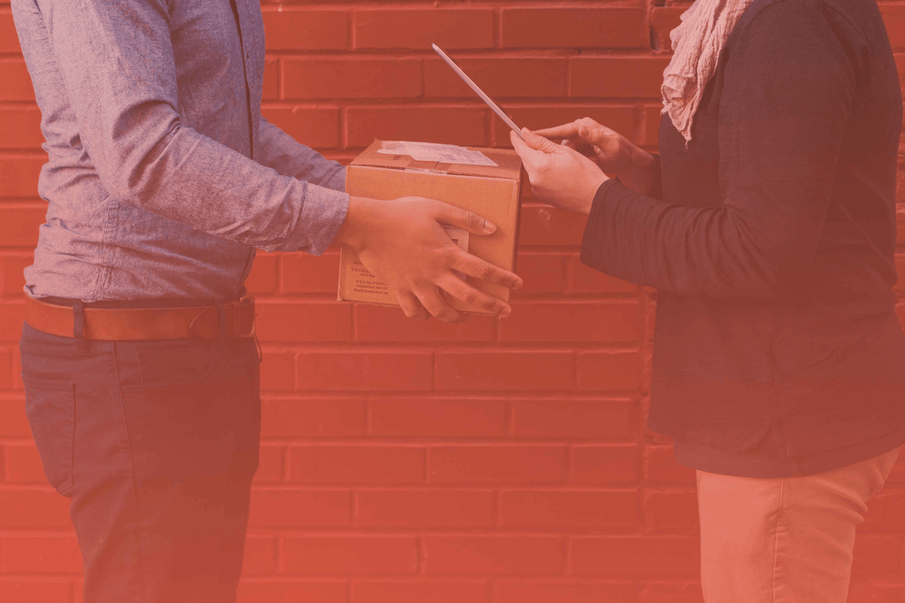 Business professionals managing product shipments with digital tools, representing SKU standardization, inventory accuracy, and Pimcore-powered product information management