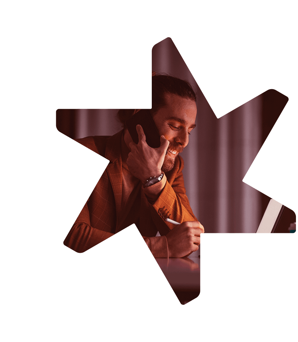 Tandemite banner: Man talking on a phone during work