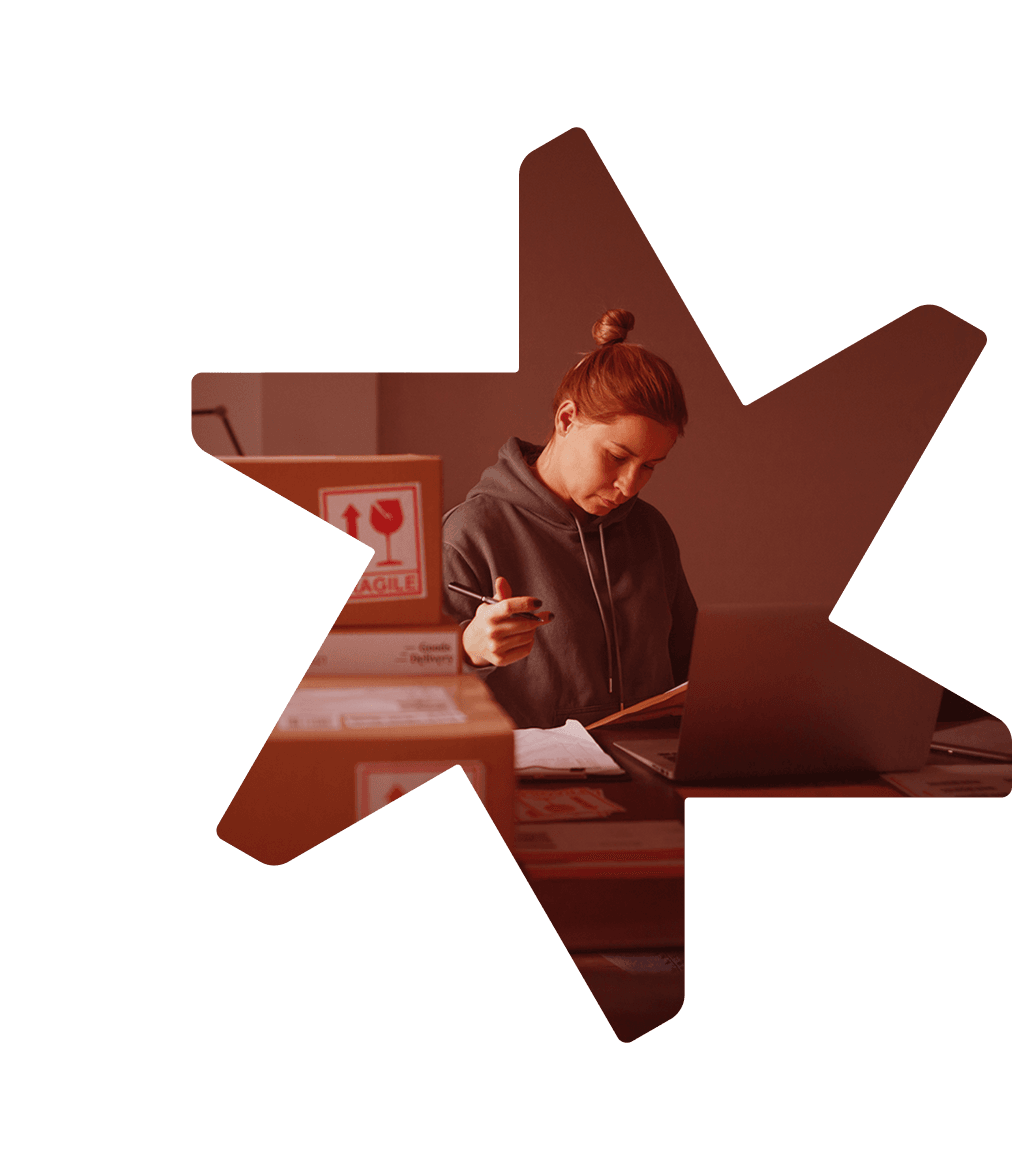 Tandemite banner: Woman checking parcels for delivery and using laptop