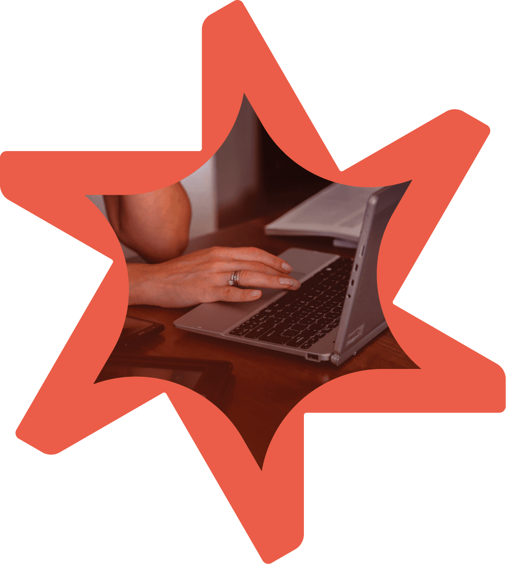 Tandemite banner: Hand clicking on laptop keyboard