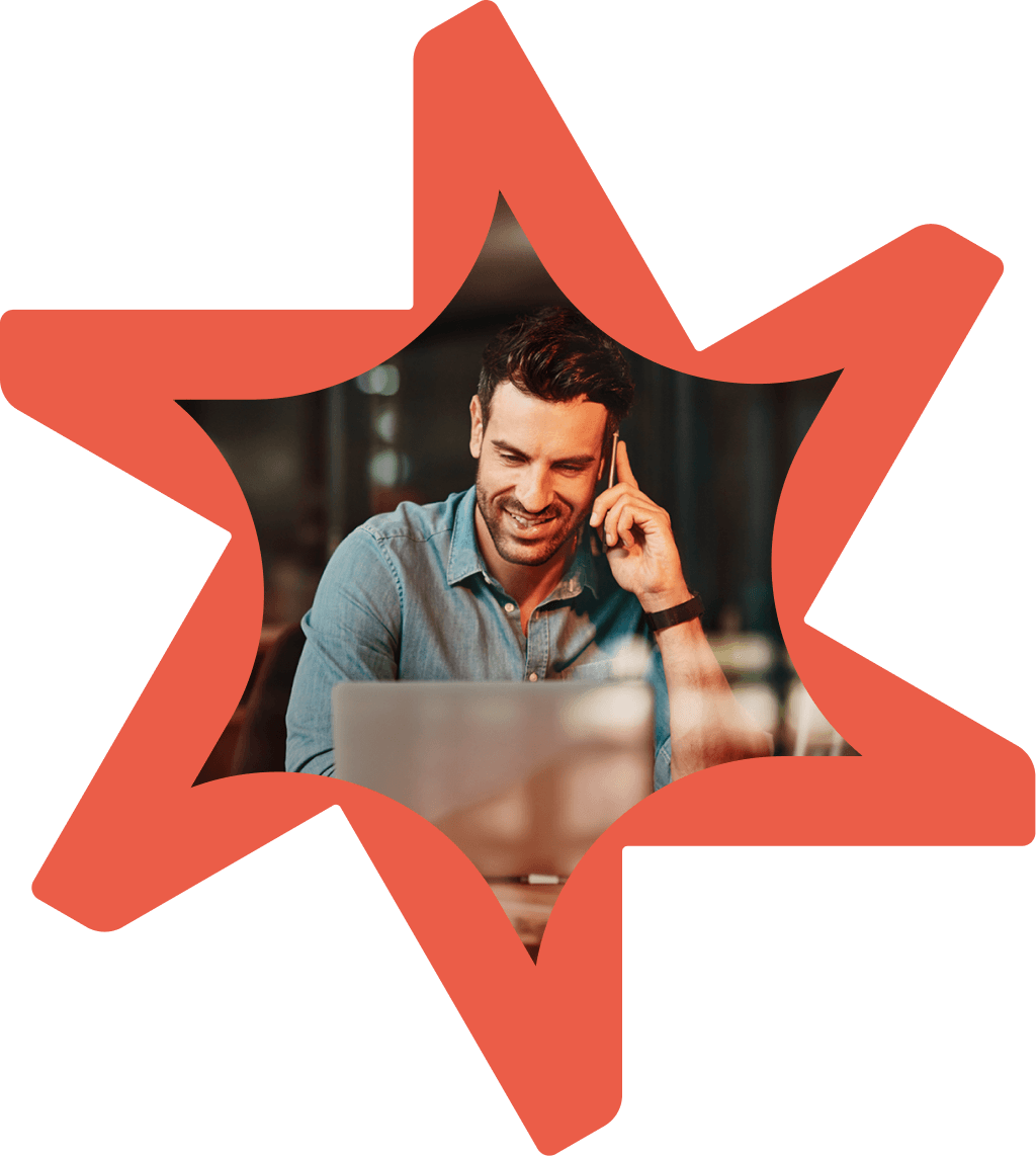 Tandemite banner: Man with a laptop talking on a phone