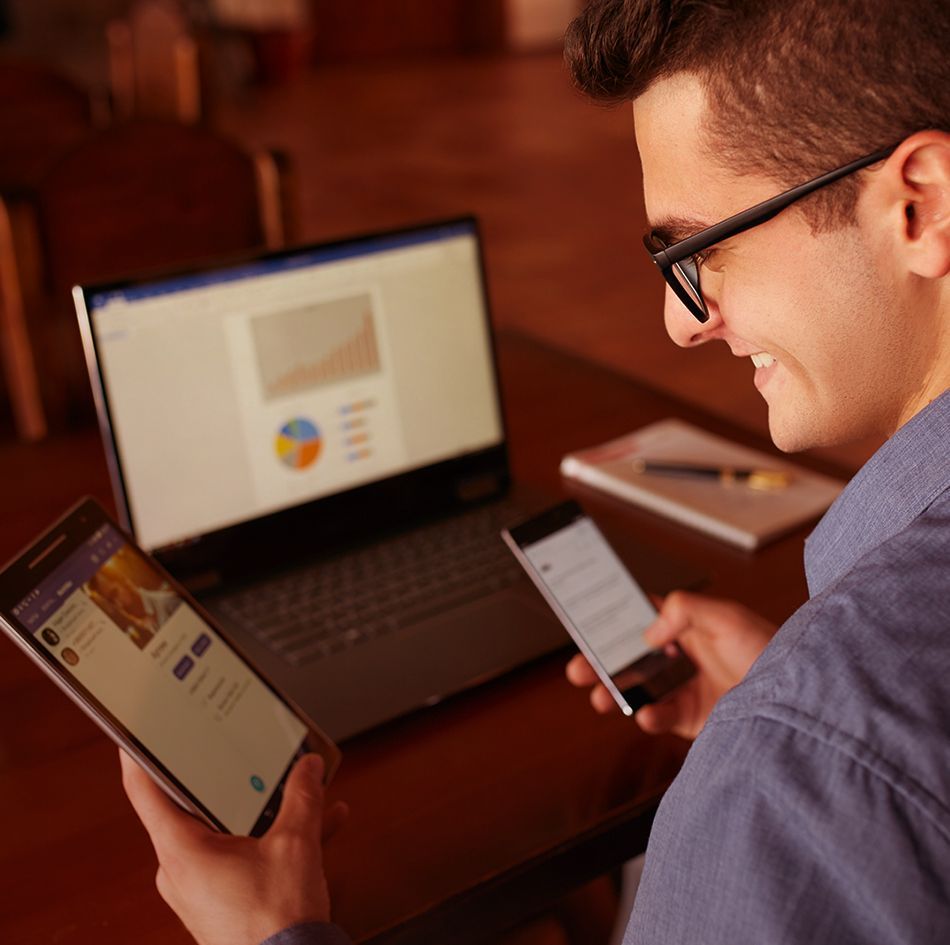Man using laptop, tablet pc and mobile phone at the same time_image