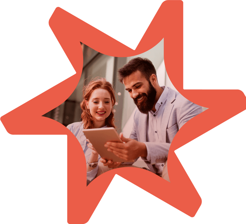 Two professionals using tablet to collaborate on digital commerce projects