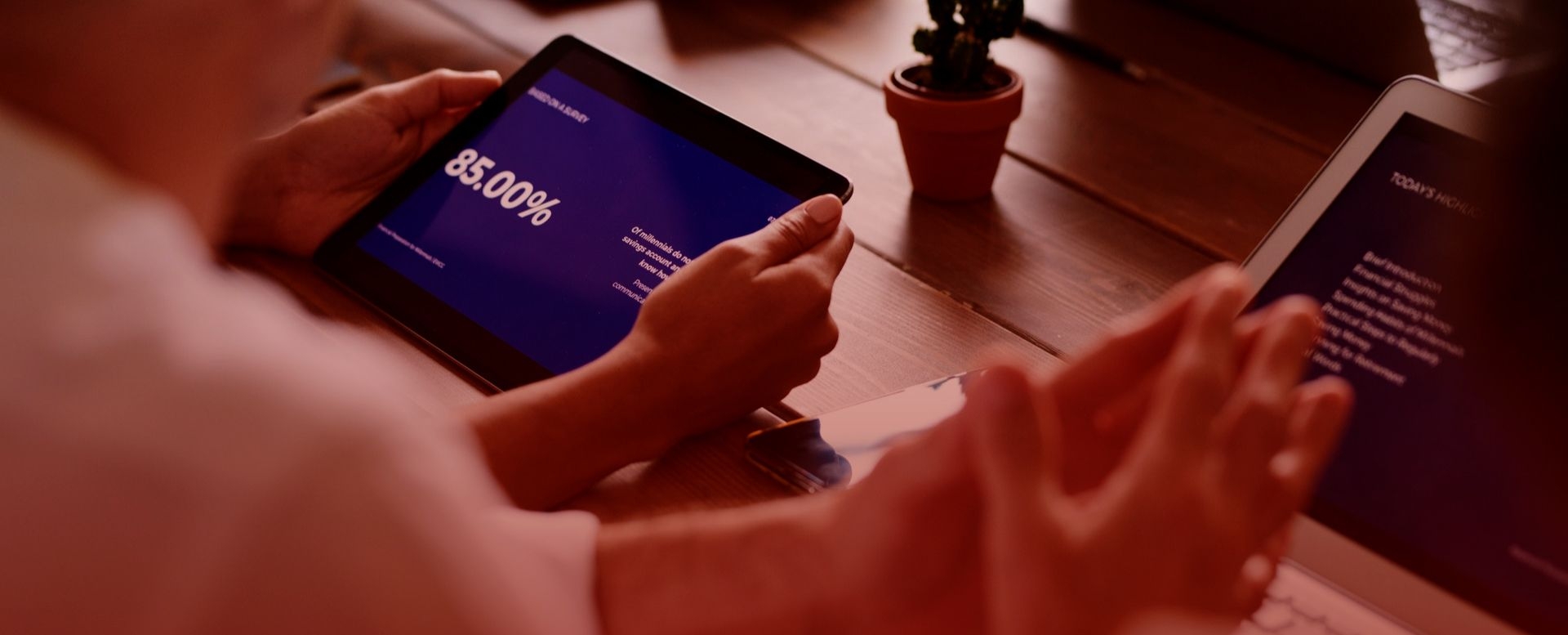 Cropped hands of team members using tablet computer and laptop in meeting_image